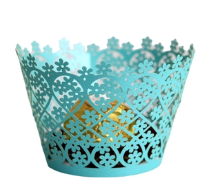 Laser cut light blue cupcake wrapper with intricate floral lace patterns for baking