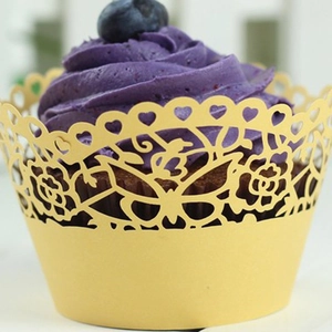 Laser-cut cupcake wrapper with butterfly and flower patterns for wedding party decor