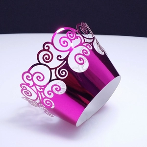Intricate laser-cut cloud pattern cupcake wrapper in dark purple metallic finish