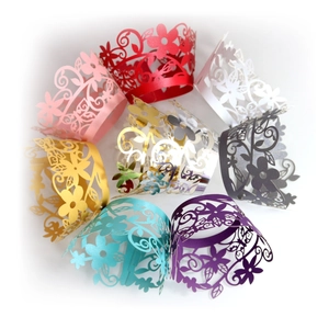 Laser cut floral cupcake wrappers in various colors for elegant dessert table decoration