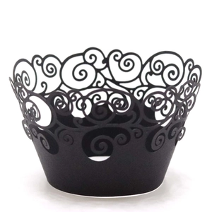 Elegant black laser-cut cupcake wrappers with intricate vine filigree for party decorations