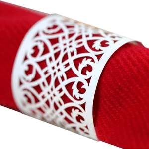Elegant white laser-cut paper napkin ring featuring intricate hollow vine patterns