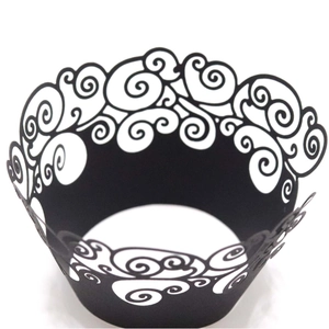Elegant black laser-cut hollow lace cupcake wrappers with intricate swirl pattern