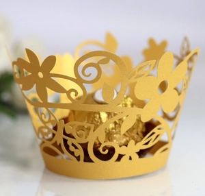 Elegant gold laser-cut cupcake wrapper with floral patterns for dessert table decoration