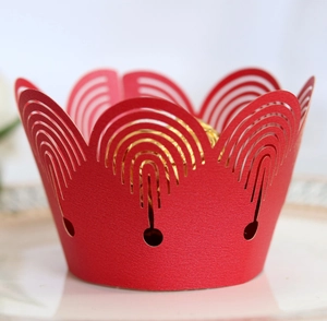 Lace cut laser paper cupcake wrappers in red crown design for elegant holiday baking