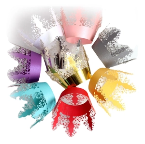 Multi-color laser cut snowflake cupcake wrappers in pearlescent paper for Christmas party