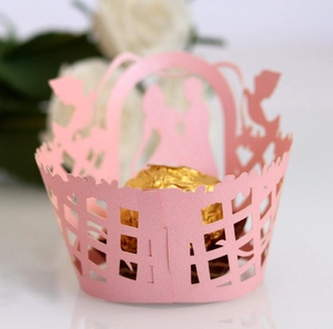 Pink laser-cut cupcake wrapper featuring a romantic silhouette and bird hollow design