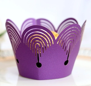 Purple laser-cut crown cupcake wrapper with hollow arch pattern for party decorations