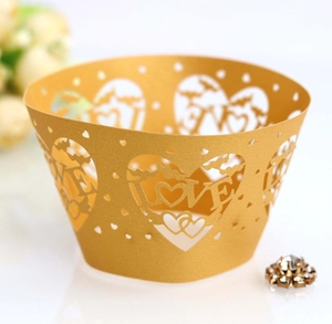 Laser cut gold pearl paper cupcake liners with LOVE and heart patterns for wedding decor