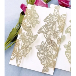 Elegant laser cut wedding invitation with golden glitter butterfly and floral pattern