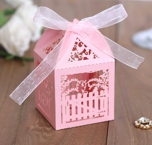 Pink laser-cut European fence style candy box with a white organza ribbon bow for weddings