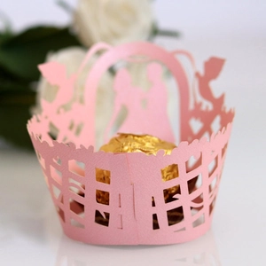 Pink laser-cut cupcake wrapper with romantic couple and heart patterns for weddings