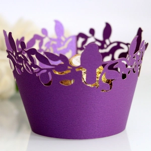 Purple laser cut bird and leaf cupcake wrappers for elegant wedding cake decoration