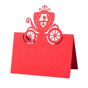 Elegant red laser-cut wedding place card featuring a detailed princess carriage design
