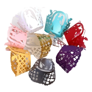 Laser-cut hollow cupcake wrappers with wedding couple silhouette in various vibrant colors