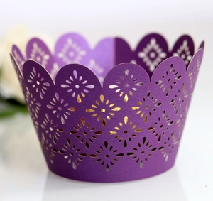 Purple laser cut cupcake wrapper with floral patterns and scalloped edges for weddings