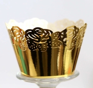 Detailed laser-cut gold lace cupcake wrappers with intricate floral rose patterns