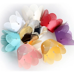 Laser cut hollow muffin cupcake paper wrappers in assorted vibrant colors for party decor