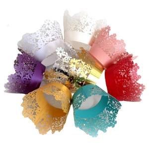 Hollow laser-cut cupcake wrappers in multiple pearlescent colors for party baking decor