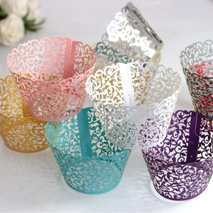 Laser cut floral cupcake wrappers in assorted pearlescent colors for elegant party decor