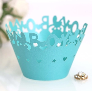 Sky blue laser-cut cupcake wrappers with BOY text and heart star hollow patterns