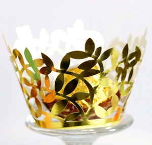 Golden laser cut cupcake wrappers with vine patterns for elegant wedding party decoration