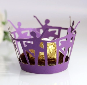 Detail of purple laser-cut ballet dancer cupcake wrapper with elegant镂空 lace design