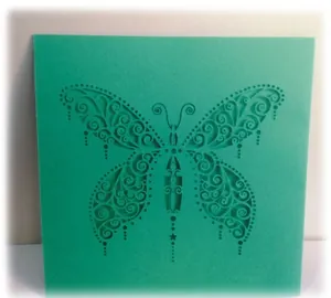 Laser cut green butterfly wedding greeting card with elegant pearlized paper texture