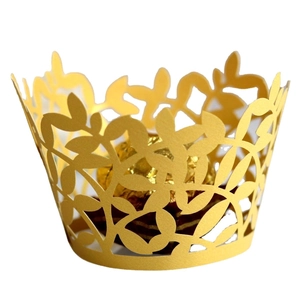 Golden laser cut cupcake wrappers with hollow leaf pattern for elegant baking decoration
