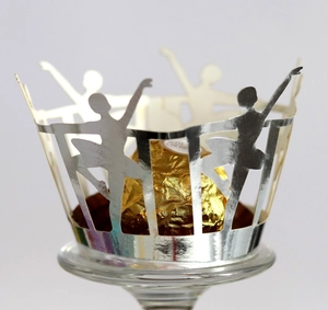 Elegant silver laser-cut cupcake wrappers with ballerina silhouette and crown design