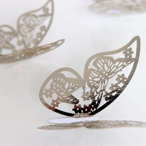 Glossy silver 3D butterfly wall stickers with laser-cut floral patterns for home decor