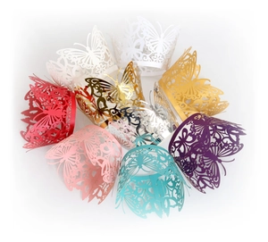 Laser-cut butterfly lace cupcake wrappers in assorted pearlescent colors for wedding decor