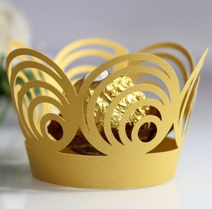 Gold laser-cut cupcake wrappers with crown design for elegant dessert presentation