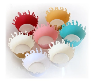 Golden laser-cut cupcake wrappers with Congratulations text in assorted colors
