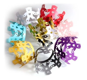 Laser cut bear cupcake wrappers in multiple colors with hollow heart patterns