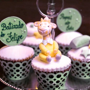 Laser cut light blue cupcake wrapper with handcrafted giraffe topper for baby shower