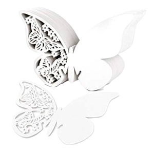 Laser-cut white paper butterfly place cards for weddings featuring hollow butterfly patterns