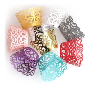 Detailed laser-cut filigree cupcake wrappers in multiple vibrant metallic colors