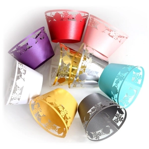Lace hollowed cupcake wrappers in various pearlized colors for baking decoration