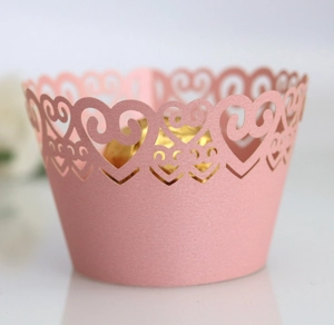 Pink laser-cut cupcake wrappers with heart pattern for wedding party decorations