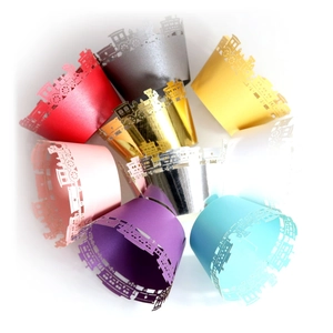 Laser cut train cupcake wrappers in multiple vibrant colors for party decorations