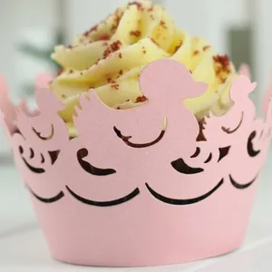 Pink laser-cut cupcake wrappers featuring a cute duck pattern for party decorations