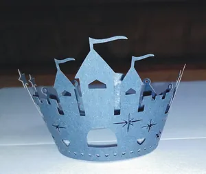 Blue glitter castle cake topper crown with star and heart cutouts for party decor