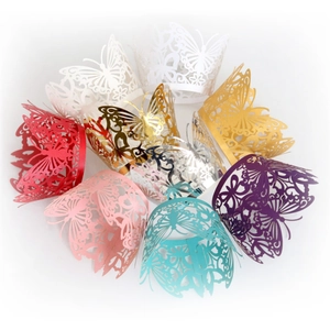 Laser cut butterfly cupcake wrappers in various colors for elegant party decor