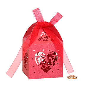 Red laser-cut wedding favor box with LOVE heart design and a matching silk ribbon bow