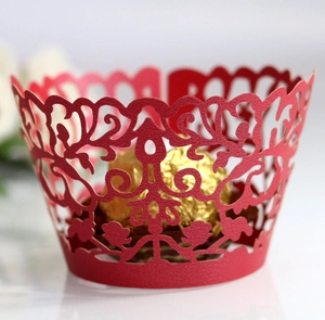 Red laser-cut lace cupcake wrappers with elegant floral hollow patterns for muffins