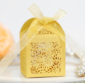 Detailed laser-cut hollow pattern and yellow ribbon bow on wedding candy gift box
