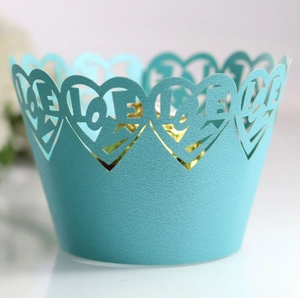 Sky blue laser-cut cupcake wrapper with heart border and LOVE lettering for weddings