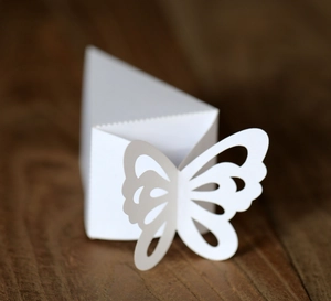 White laser-cut butterfly wedding favor box with triangle shape for party candies