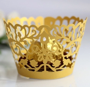 Detailed laser-cut gold hollow cupcake wrappers featuring elegant floral and scroll patterns